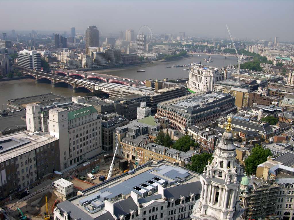 London St. Pauls Cathedral 09 Golden Gallery View Of Thames We climbed 86m to the Golden Gallery at St. Pauls Cathedral and enjoyed a spectacular view of London. Here is the view to the south west with the Thames River snaking through London, and the London Eye ferris wheel visible on the horizon.